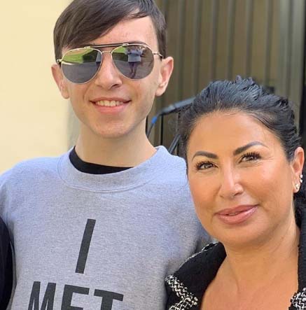 Samantha Marie Olit pose for a picture with her son.
